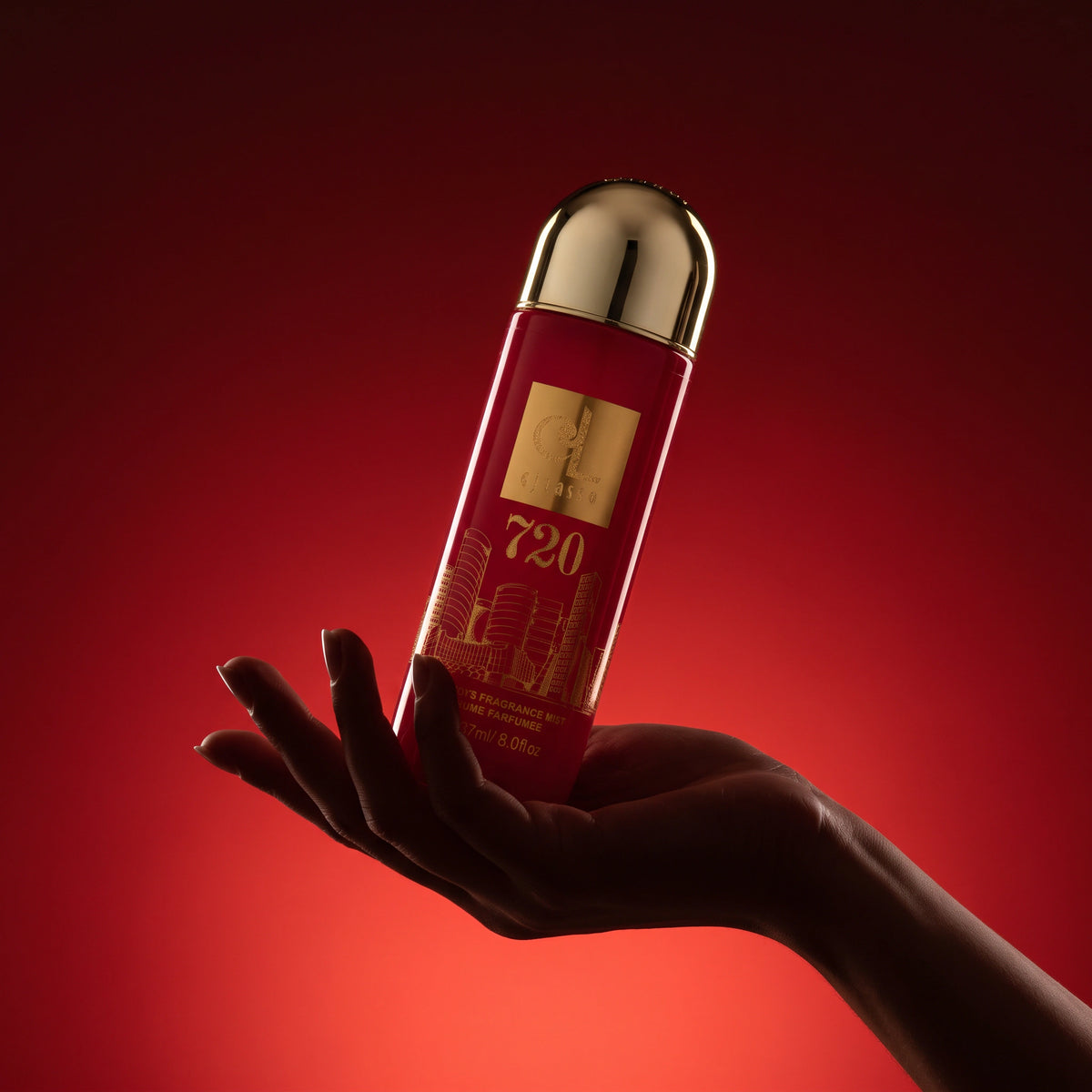 Hand holding the 720 Women fragrance mist